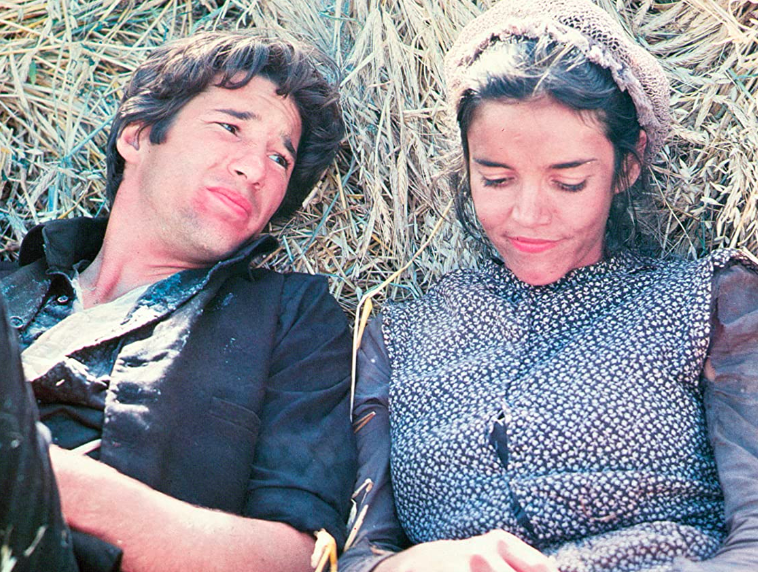 Poster of Terrence Malick’s Days of Heaven (1978) showing a rural couple in wheat fields at sunset